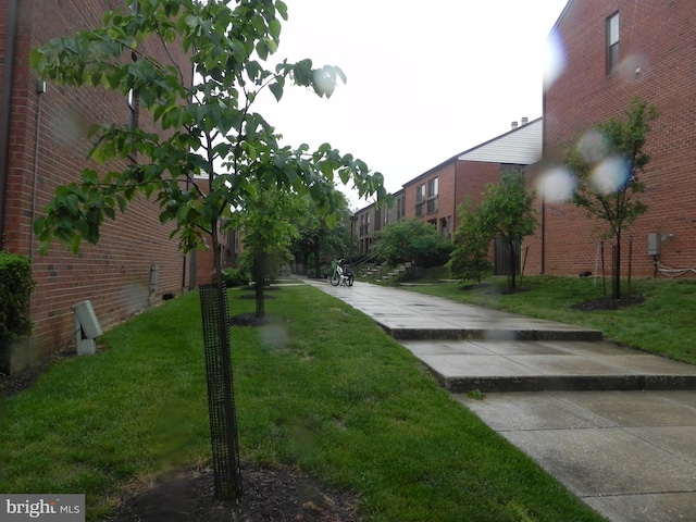 surrounding community featuring a yard