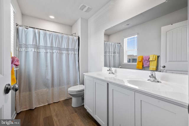 1638 Terrapin Cir, Cambridge, MD 21613 - full bathroom featuring toilet, wood finished floors, double vanity, and a shower with shower curtain