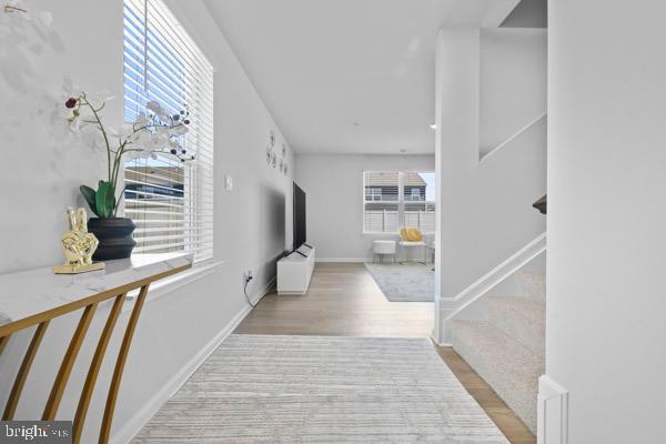 1638 Terrapin Cir, Cambridge, MD 21613 - hall with wood finished floors, baseboards, and stairs
