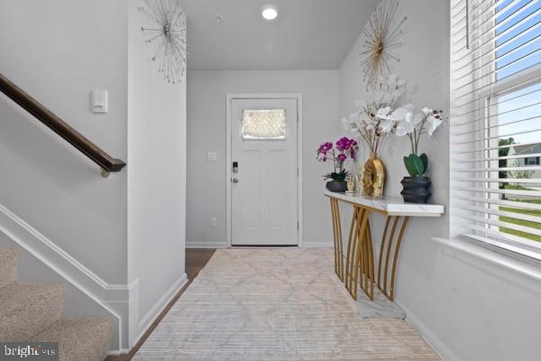 1638 Terrapin Cir, Cambridge, MD 21613 - foyer entrance featuring stairs and baseboards