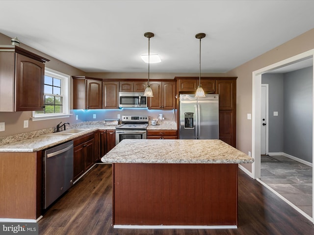 1497 Double Church Rd, Stephens City, VA 22655 - kitchen featuring stainless steel appliances, a sink, a center island, decorative light fixtures, and dark wood-style flooring