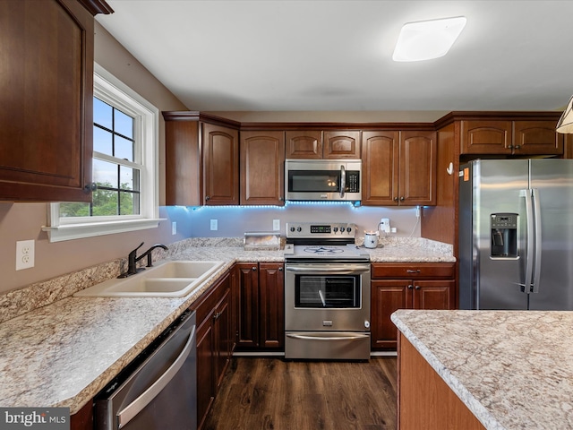 1497 Double Church Rd, Stephens City, VA 22655 - kitchen featuring appliances with stainless steel finishes, a sink, dark wood-type flooring, and light countertops