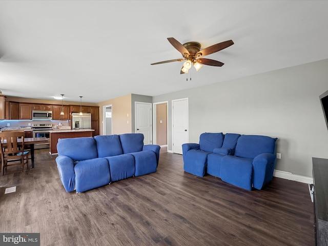 1497 Double Church Rd, Stephens City, VA 22655 - living room featuring baseboards, dark wood-style flooring, and ceiling fan