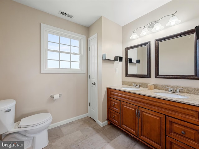 1497 Double Church Rd, Stephens City, VA 22655 - bathroom with toilet, baseboards, and double vanity