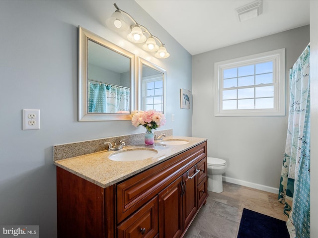 1497 Double Church Rd, Stephens City, VA 22655 - full bath with double vanity, toilet, and baseboards