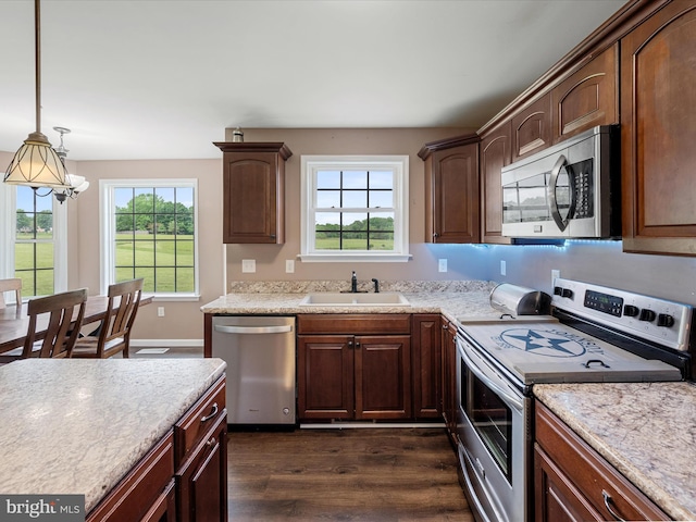 1497 Double Church Rd, Stephens City, VA 22655 - kitchen featuring appliances with stainless steel finishes, a sink, dark wood-style floors, a chandelier, and hanging light fixtures