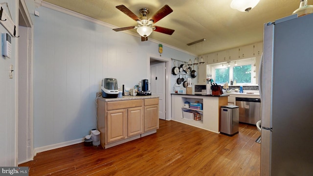 504 SE Front St, Milford, DE 19963 - kitchen featuring appliances with stainless steel finishes, wood finished floors, a ceiling fan, and crown molding