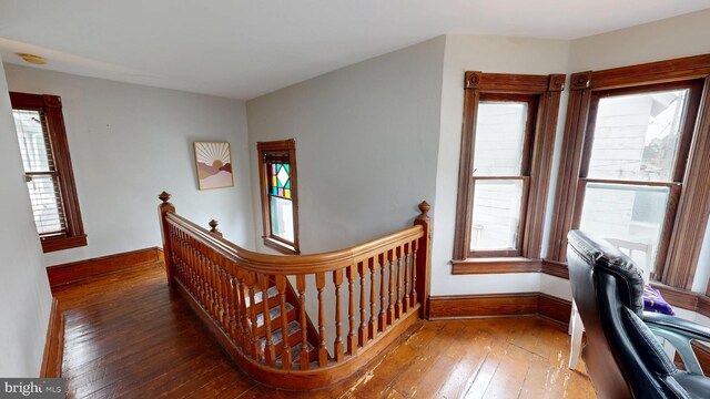 504 SE Front St, Milford, DE 19963 - stairway with wood-type flooring and baseboards
