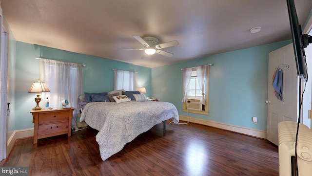 504 SE Front St, Milford, DE 19963 - bedroom with dark wood-type flooring, baseboards, and a ceiling fan