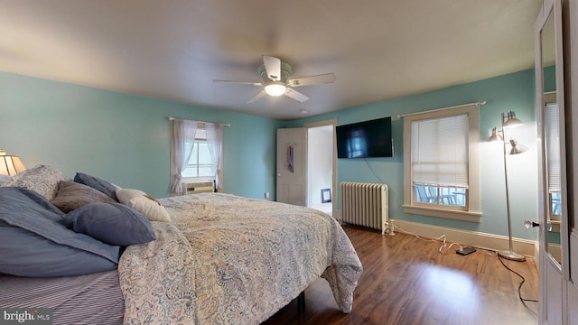 504 SE Front St, Milford, DE 19963 - bedroom with radiator heating unit, wood finished floors, baseboards, and a ceiling fan
