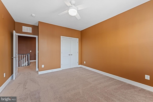 42869 Littlehales Ter, Ashburn, VA 20148 - unfurnished bedroom featuring light carpet, baseboards, a closet, and ceiling fan