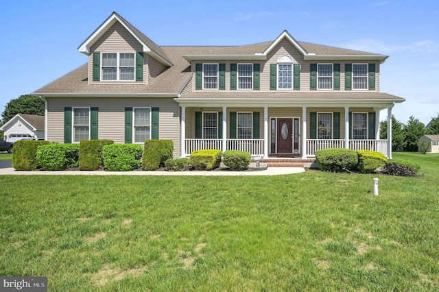 99 Topaz Ln, Camden Wyoming, DE 19934 - colonial house with a front lawn, a porch, and roof with shingles