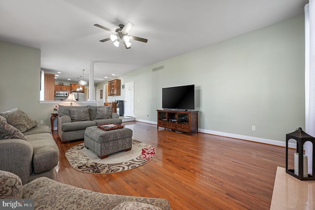 99 Topaz Ln, Camden Wyoming, DE 19934 - living room with a ceiling fan, wood finished floors, baseboards, ornate columns, and recessed lighting