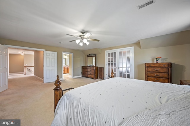 99 Topaz Ln, Camden Wyoming, DE 19934 - bedroom with french doors, light colored carpet, baseboards, a ceiling fan, and connected bathroom
