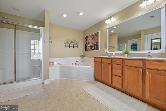 99 Topaz Ln, Camden Wyoming, DE 19934 - full bathroom featuring a stall shower, double vanity, a garden tub, and tile patterned floors