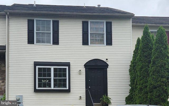 view of front of house featuring roof with shingles