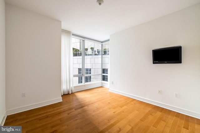 1414 S Penn Sq Unit 9A, Philadelphia, PA 19102 - empty room with light wood-style flooring and baseboards