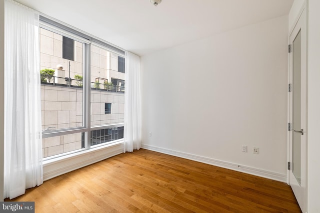 1414 S Penn Sq Unit 9A, Philadelphia, PA 19102 - empty room with wood finished floors and baseboards