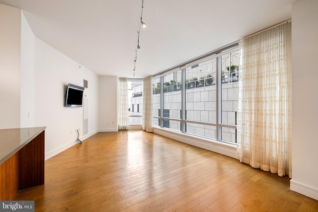1414 S Penn Sq Unit 9A, Philadelphia, PA 19102 - unfurnished dining area with light wood-style floors and baseboards