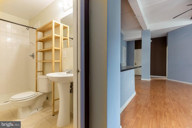 1324 Locust St Unit 1602, Philadelphia, PA 19107 - full bathroom with toilet, a stall shower, wood finished floors, and baseboards