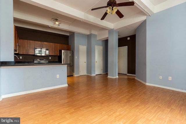 1324 Locust St Unit 1602, Philadelphia, PA 19107 - unfurnished living room with ceiling fan, light wood-style floors, and baseboards