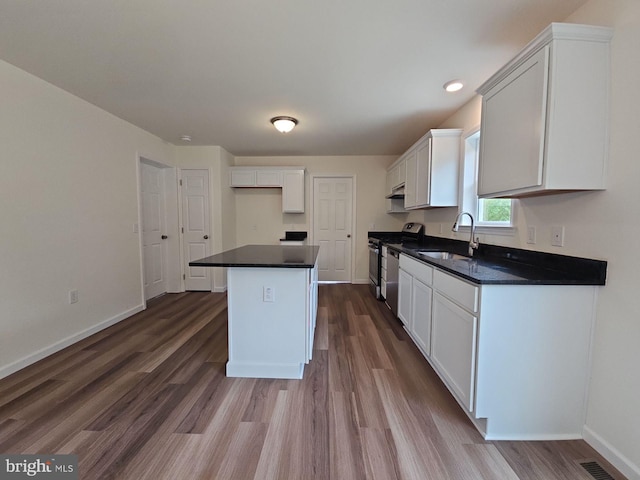 213 Newport Rd, Millville, NJ 08332 - kitchen with a sink, stainless steel gas stove, dark wood-type flooring, dark countertops, and recessed lighting