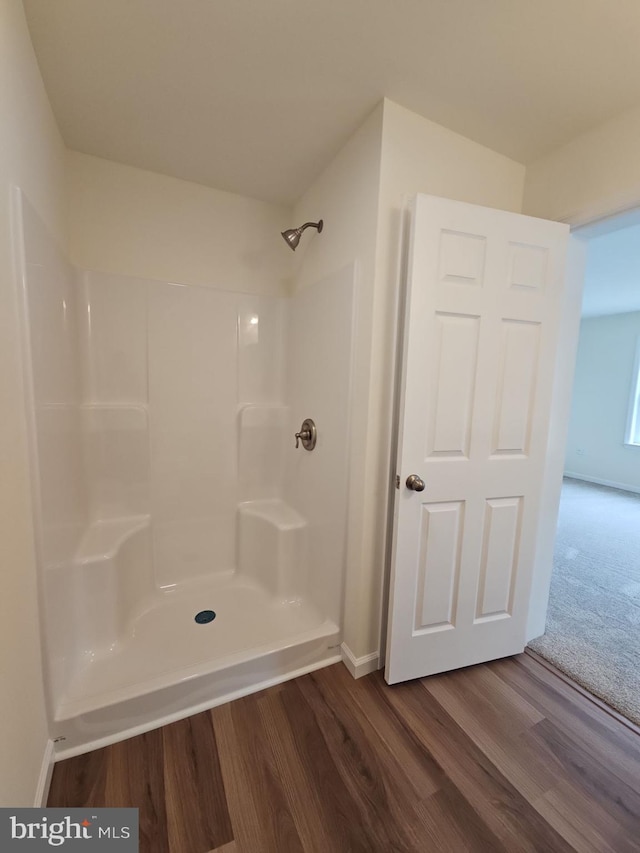 213 Newport Rd, Millville, NJ 08332 - full bath featuring wood finished floors, a shower, and baseboards