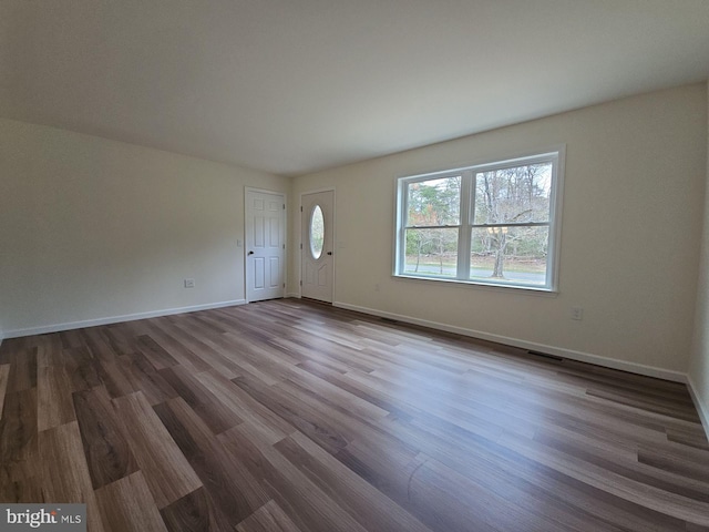 213 Newport Rd, Millville, NJ 08332 - unfurnished living room featuring dark wood-style flooring and baseboards