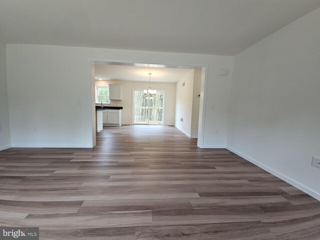 213 Newport Rd, Millville, NJ 08332 - spare room with a chandelier, wood finished floors, and baseboards