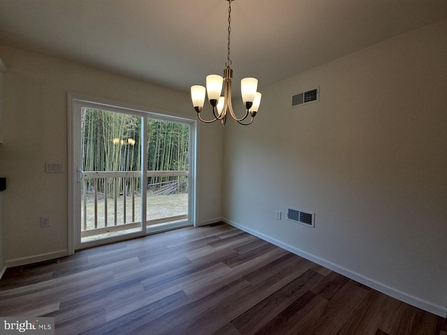 213 Newport Rd, Millville, NJ 08332 - unfurnished dining area with a chandelier, wood finished floors, and baseboards