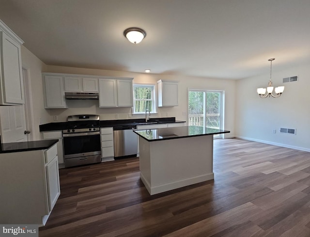 213 Newport Rd, Millville, NJ 08332 - kitchen featuring stainless steel appliances, dark countertops, under cabinet range hood, and a sink