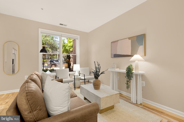 living room with light wood-style floors and baseboards