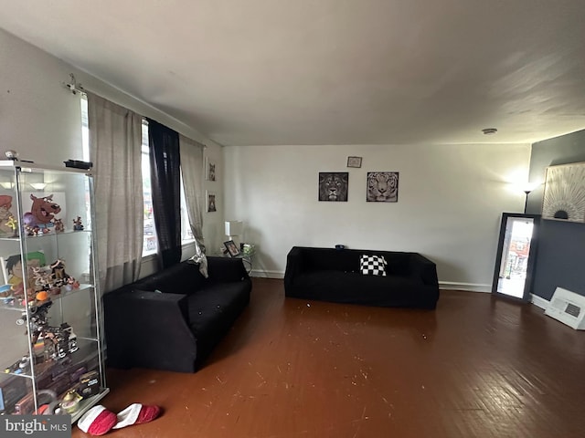 living area featuring wood finished floors and baseboards