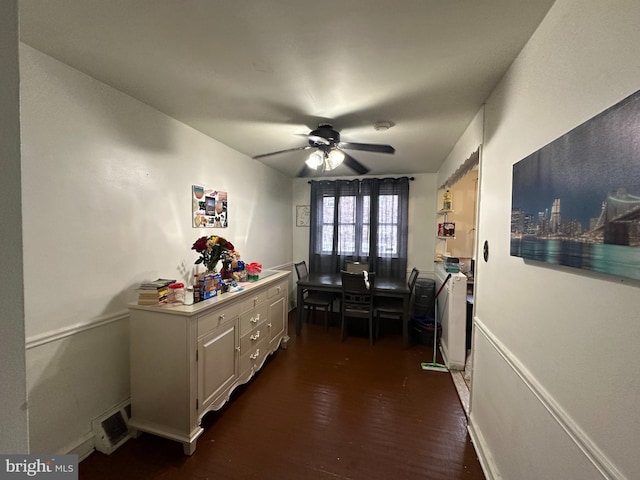 interior space with dark wood-style flooring and baseboards