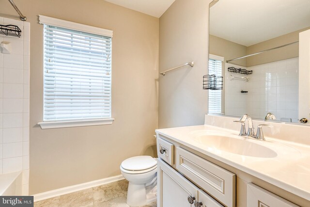 bathroom with a shower, toilet, vanity, and baseboards