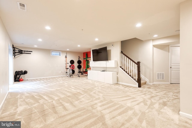basement with carpet flooring, recessed lighting, stairs, and baseboards