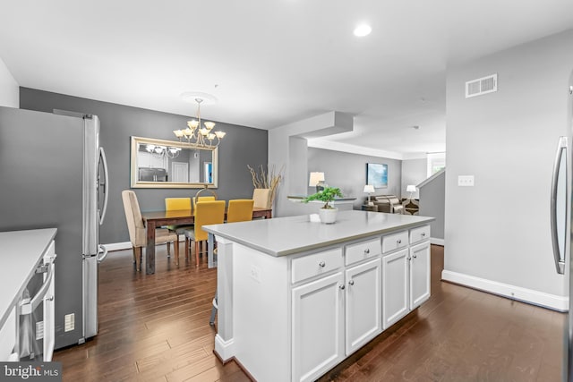 7820 Loblolly Way, Hanover, MD 21076 - kitchen with freestanding refrigerator, dark wood finished floors, white cabinets, a chandelier, and light countertops