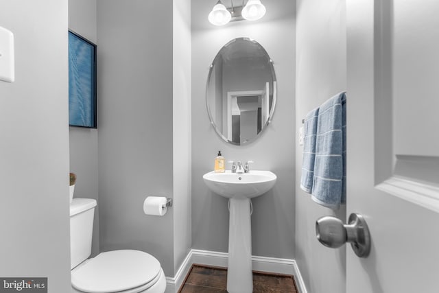 7820 Loblolly Way, Hanover, MD 21076 - half bath with toilet, baseboards, and wood finished floors