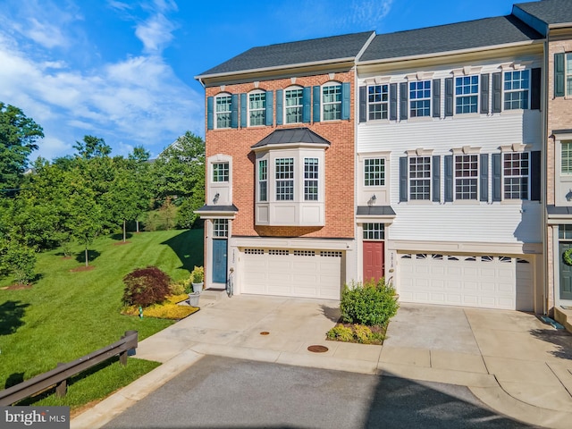 7820 Loblolly Way, Hanover, MD 21076 - view of front of home featuring driveway, a garage, brick siding, and a front lawn