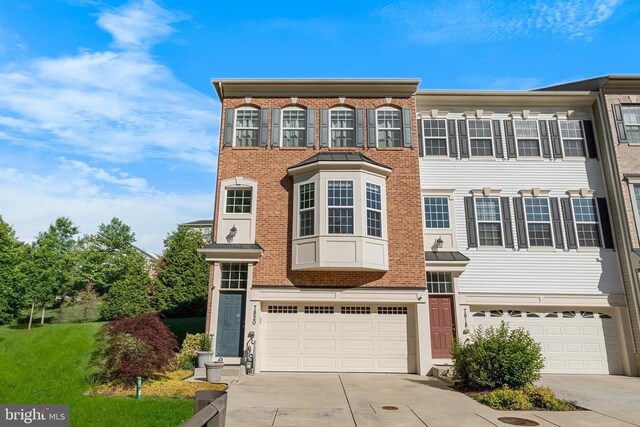 7820 Loblolly Way, Hanover, MD 21076 - view of front facade featuring a garage, driveway, and brick siding