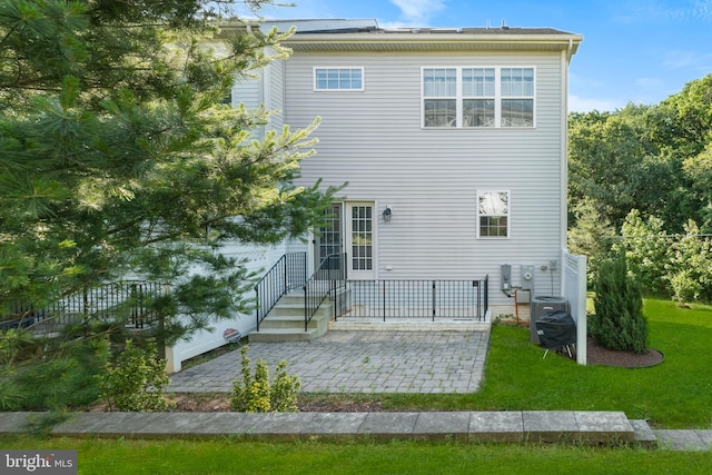 7820 Loblolly Way, Hanover, MD 21076 - back of house with a patio and a lawn