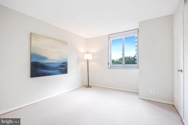 4601 N Park Ave Unit 514, Chevy Chase, MD 20815 - carpeted empty room featuring baseboards