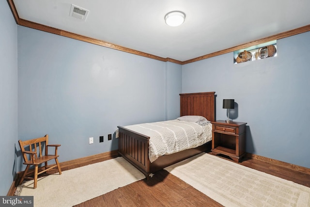 13551 Elysian Dr, Leesburg, VA 20176 - bedroom with wood finished floors, ornamental molding, and baseboards