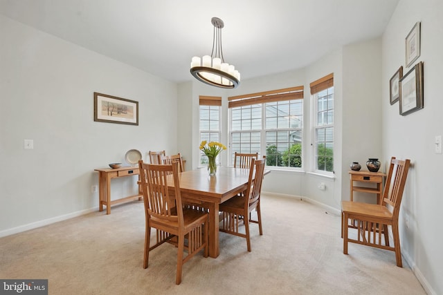 13551 Elysian Dr, Leesburg, VA 20176 - dining room with light carpet, baseboards, and a chandelier