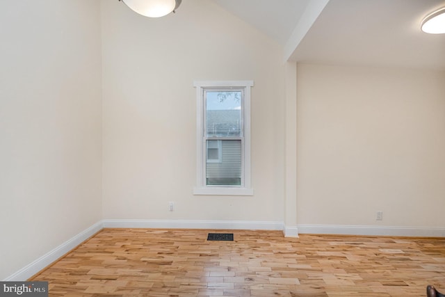 1616 S Oakland St, Arlington, VA 22204 - spare room featuring light wood finished floors, baseboards, and lofted ceiling