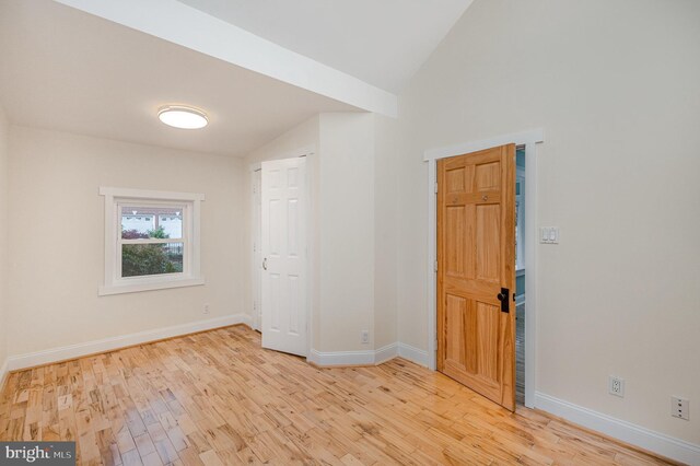 1616 S Oakland St, Arlington, VA 22204 - unfurnished room with vaulted ceiling, light wood finished floors, and baseboards