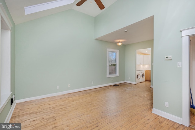 1616 S Oakland St, Arlington, VA 22204 - unfurnished room featuring washer / clothes dryer, a ceiling fan, a skylight, light wood-type flooring, and baseboards
