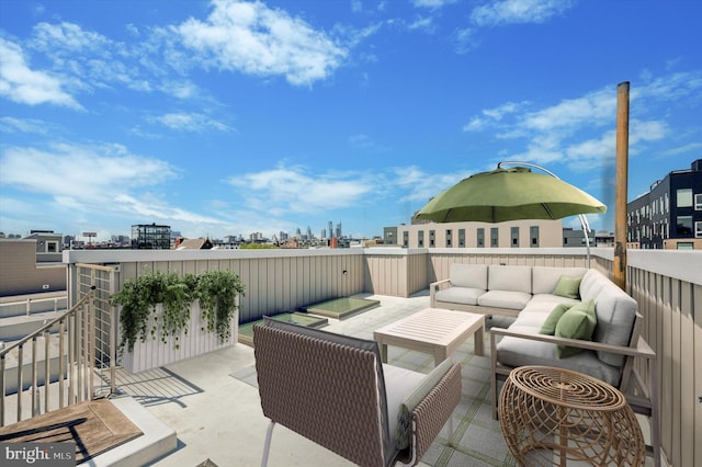 view of patio with an outdoor living space and a city view