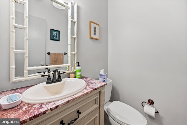 half bath with toilet and vanity