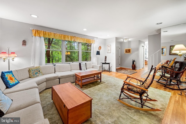 living room with light wood-style floors and recessed lighting